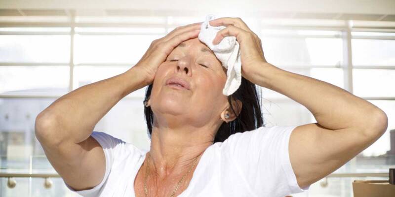 Lady indoors trying to cool down
