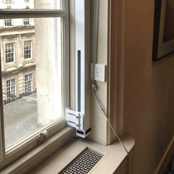 Vertical sliding actuator fitted to the bottom of a sash window