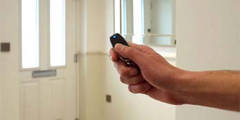 Automated entrance door controlled by a remote fob