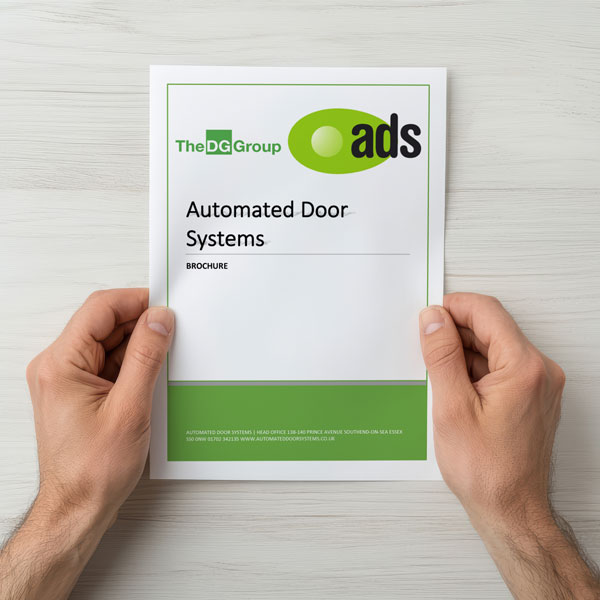 POV photos of a man holding a copy of the 2025 Automated Door Systems BROCHURE with both hands